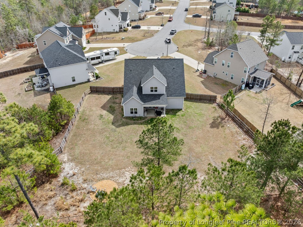 405 Turriff Way Cameron, NC 28326 - Photo 37 of 43 an aerial view of a house with a yard and trees
