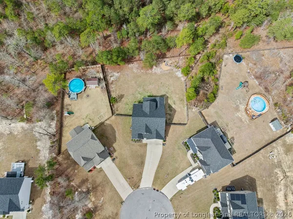 an aerial view of a house with outdoor space