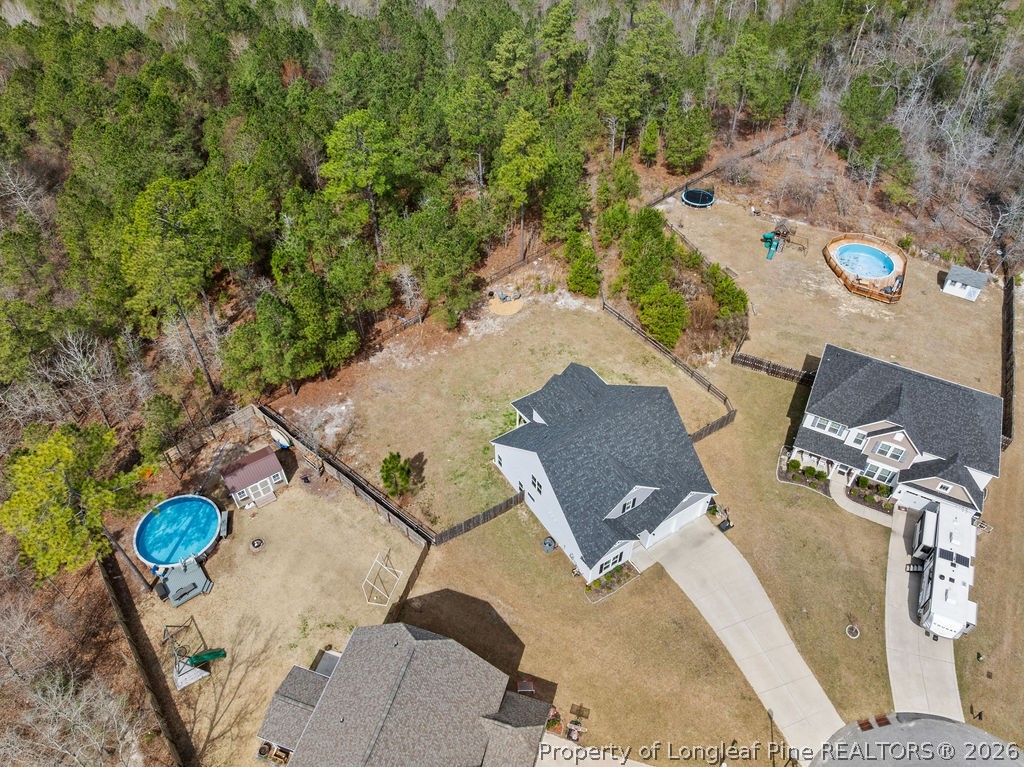 405 Turriff Way Cameron, NC 28326 - Photo 41 of 43 an aerial view of a house with a yard and trees