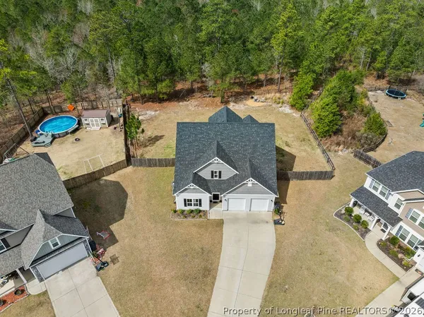 an aerial view of a house with outdoor space