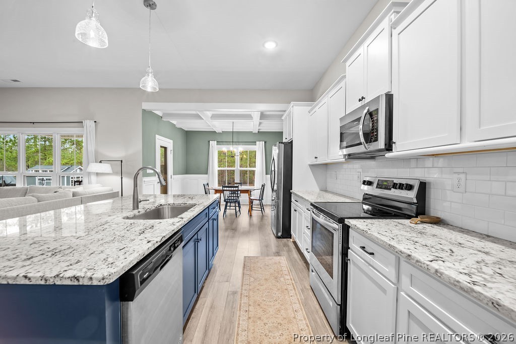 405 Turriff Way Cameron, NC 28326 - Photo 6 of 43 a large kitchen with granite countertop lots of counter top space