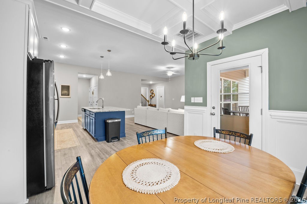 405 Turriff Way Cameron, NC 28326 - Photo 7 of 43 a dining room with a table and chairs