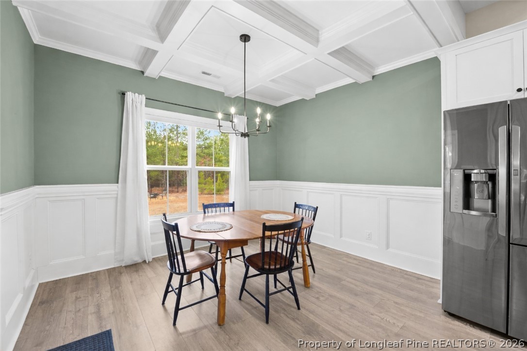 405 Turriff Way Cameron, NC 28326 - Photo 8 of 43 a view of a dining room with furniture window and wooden floor