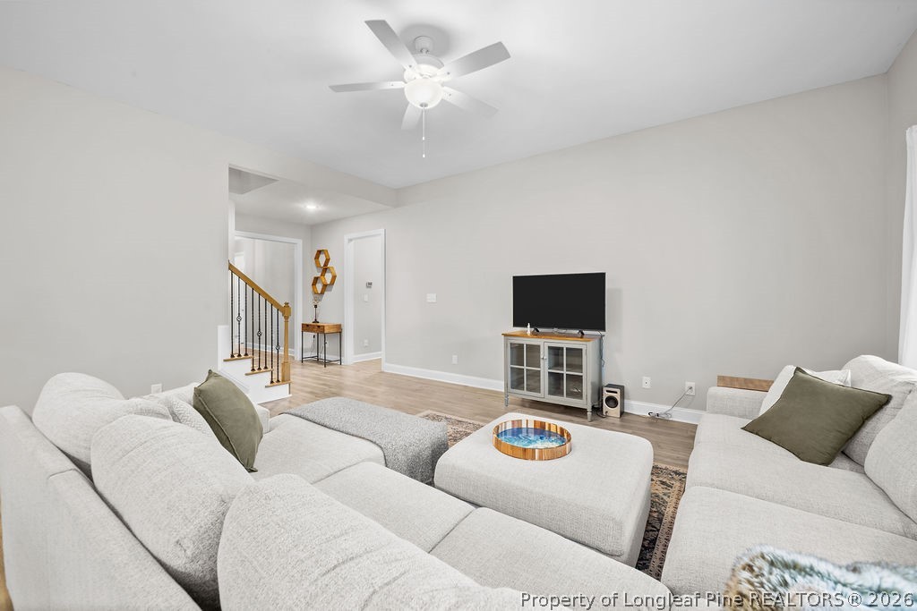 405 Turriff Way Cameron, NC 28326 - Photo 10 of 43 a living room with furniture and a flat screen tv