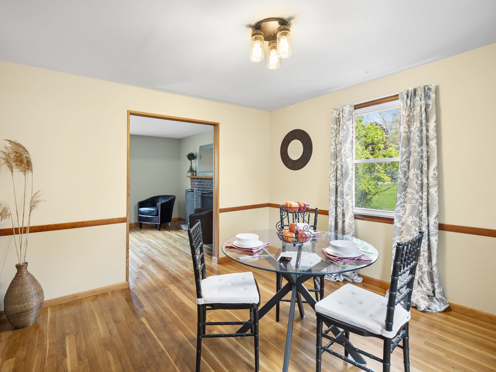 167 Karen Circle Holliston, MA 01746 - Photo 16 of 30 a view of a dining room with furniture and wooden floor