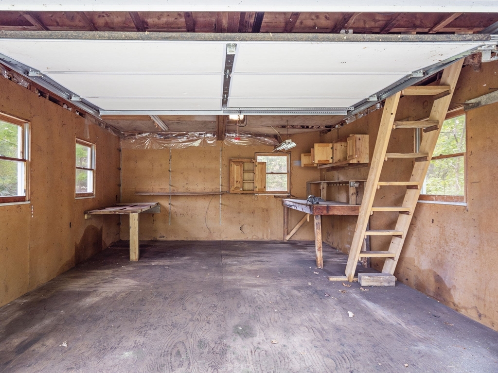 167 Karen Circle Holliston, MA 01746 - Photo 8 of 30 a view of a room with racks on the wall