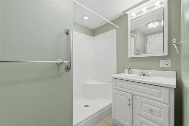 a bathroom with a sink a vanity and a mirror