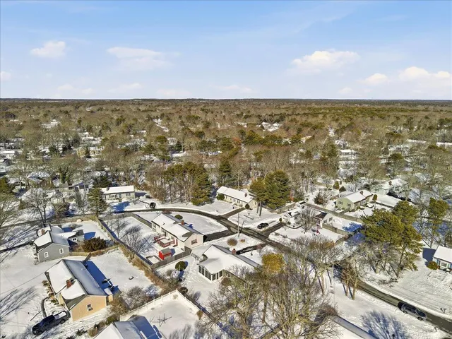 an aerial view of residential building and ocean