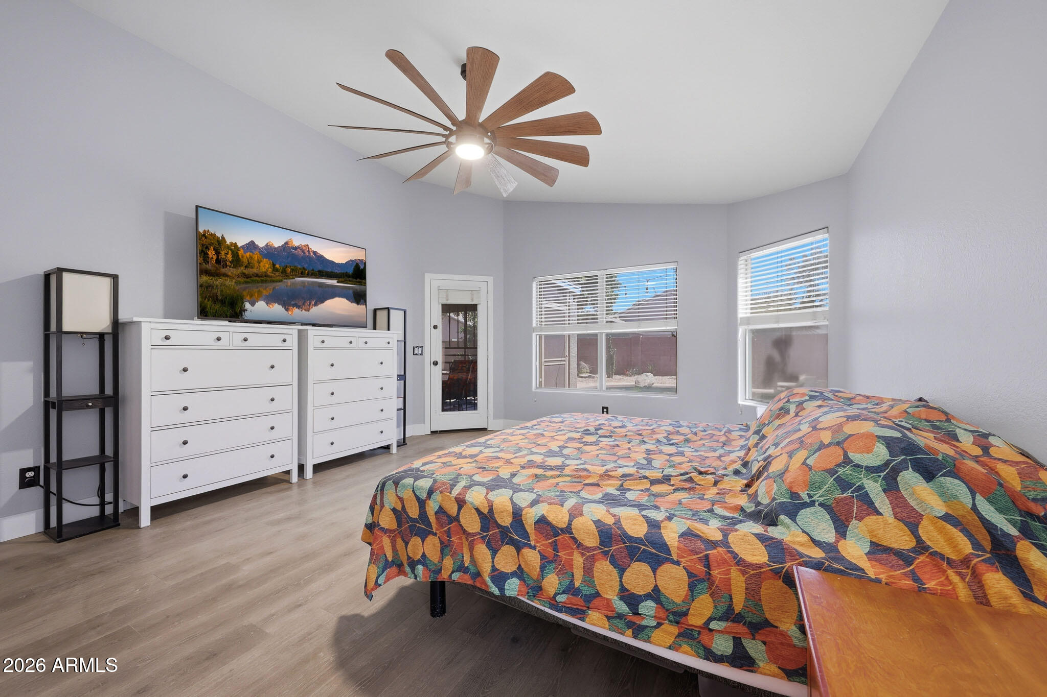 2153 East Kempton Road Chandler, AZ 85225 - Photo 37 of 50 a bedroom with a bed and wooden floor