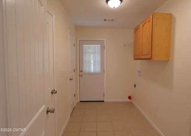 a view of a storage & utility room with a sink