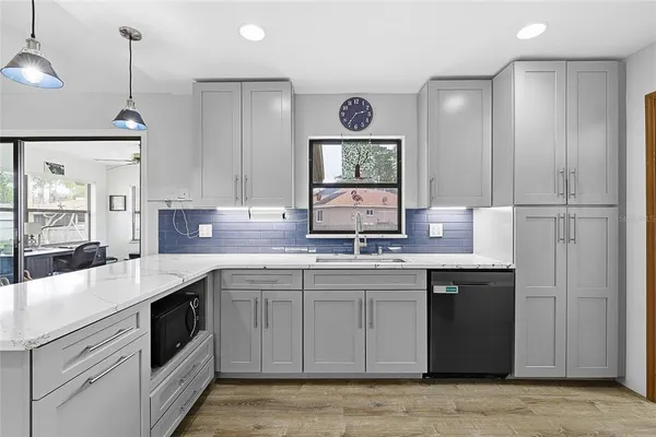 a kitchen with a sink and a refrigerator