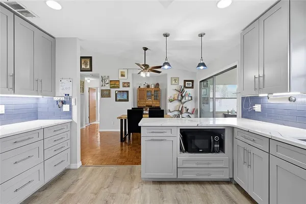 a kitchen with a sink and cabinets