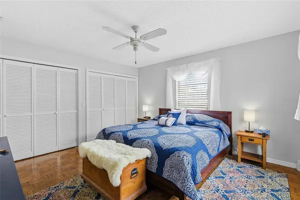 a bedroom with bed and a window