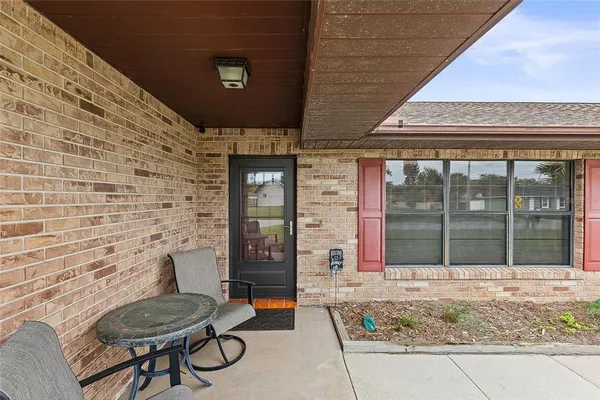 a view of house with outdoor seating space