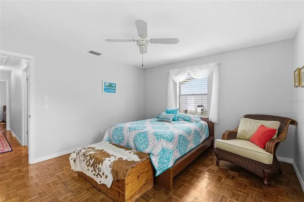 a bedroom with a bed and a couch