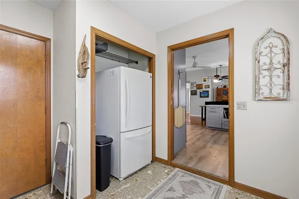 a view of a kitchen from the hallway