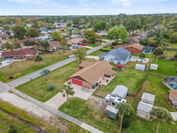 an aerial view of residential houses with outdoor space