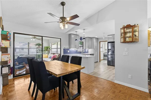 a view of a dining room with furniture window and wooden floor
