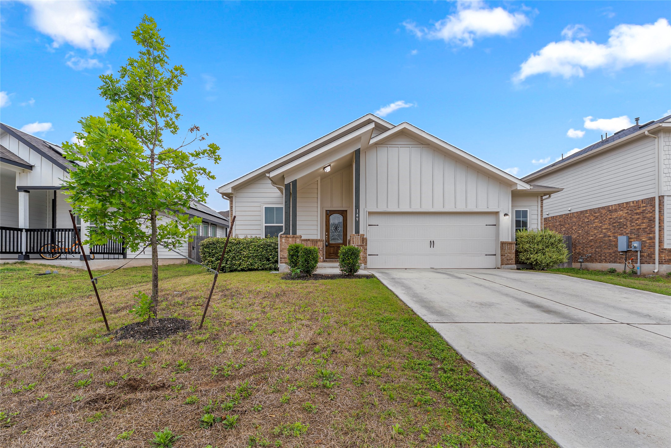 149 Biscayne Drive Kyle, TX 78640 - Photo 1 of 20 a view of backyard of house with wooden fence