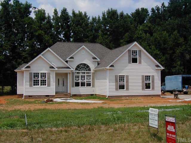 10 Fletcher Ridge Road Timberlake, NC 27583 - Photo 1 of 1 a front view of a house with garden