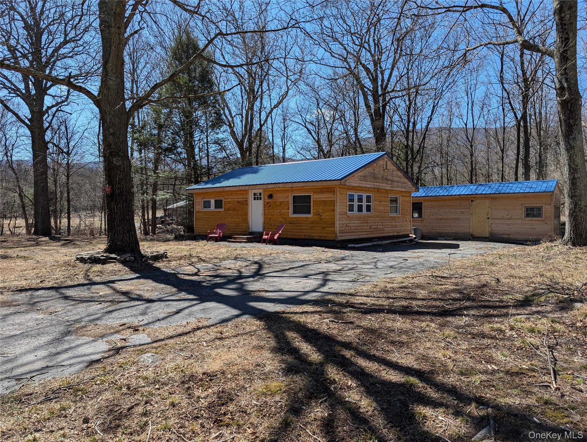 549 Hearts Content Road Cairo, NY 12473 - Photo 1 of 27 a front view of a house with a yard covered with snow