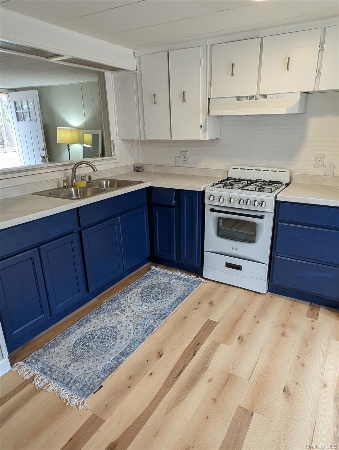 549 Hearts Content Road Cairo, NY 12473 - Photo 9 of 27 a kitchen with granite countertop a stove and a sink