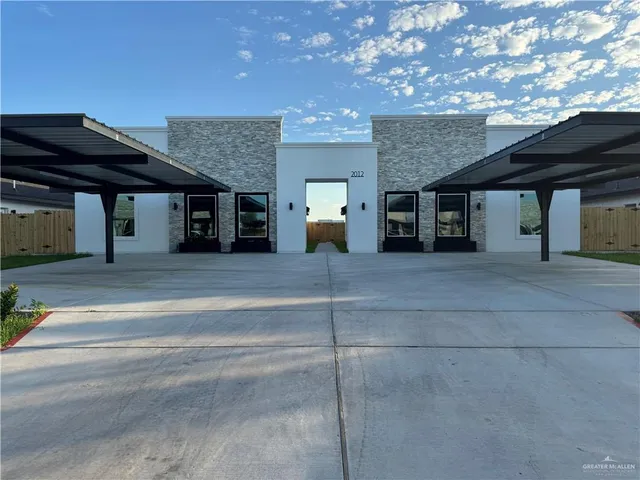 a view of a house with a street