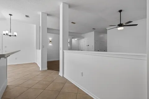 a kitchen with stainless steel appliances a refrigerator sink and microwave