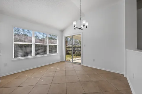 a kitchen with a stove a sink and a refrigerator