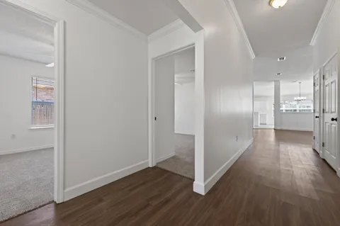 a view of wooden floor and windows in a room