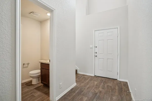 a view of a bathroom with a toilet and a shower