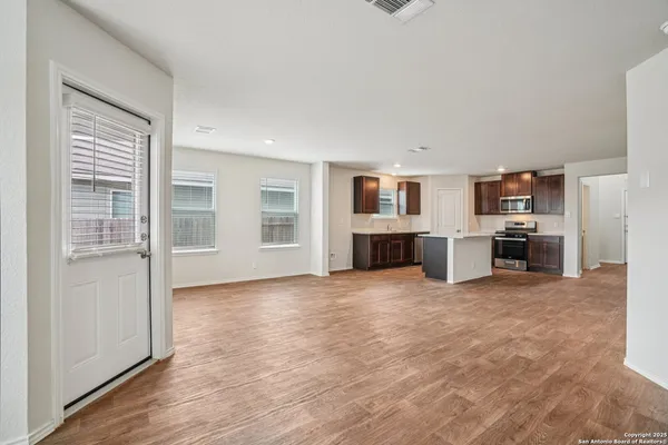 a view of living room with furniture and flat screen tv