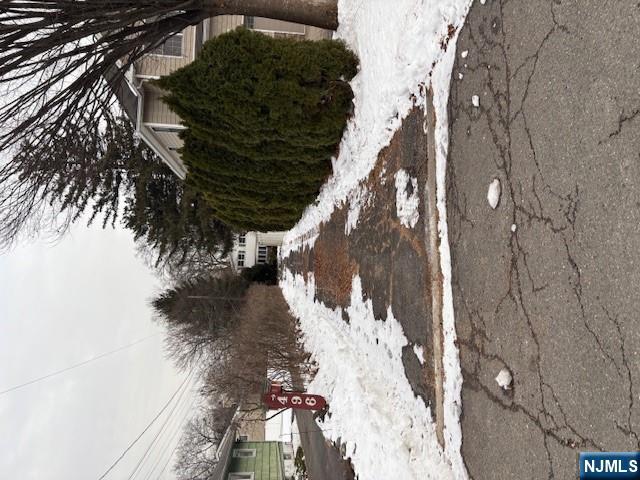 496 Cedar Lane Paramus, NJ 07652 - Photo 2 of 6 a view of a yard covered in snow