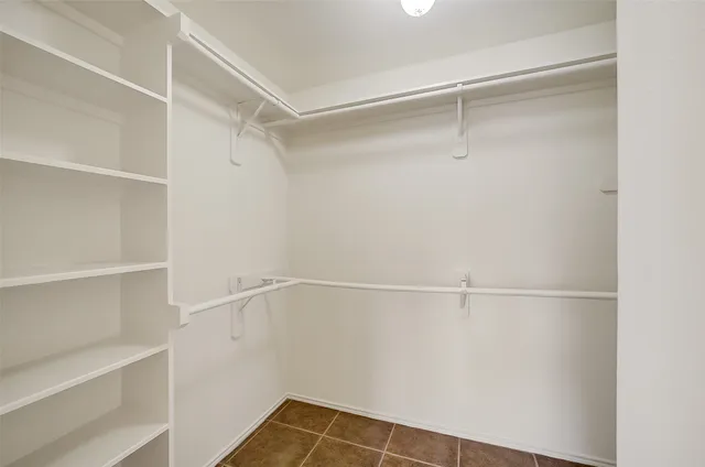 a view of an empty walk in closet