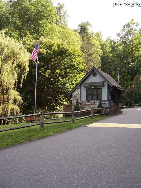 Powder Horn Mountain Road Deep Gap, NC 28618 - Photo 7 of 13 a front view of a house with a yard and trees