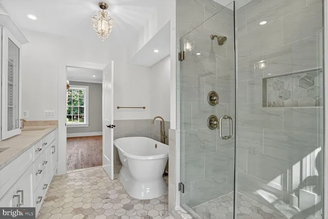 a bathroom with a granite countertop sink a toilet and shower