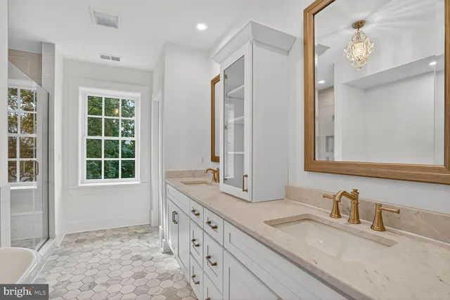a bathroom with a granite countertop sink mirror and a