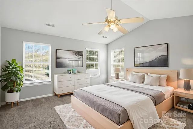 a bedroom with a large bed and a window