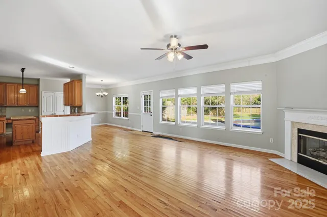 a view of a kitchen with microwave and furniture