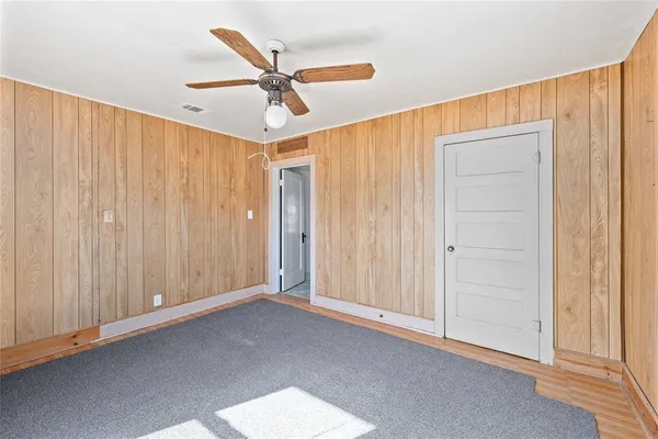 a view of a livingroom with a chandelier fan