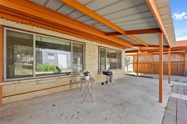 a very nice looking house with a large window