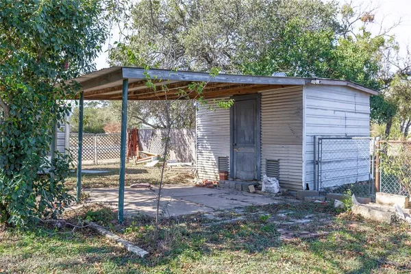 a view of a small house with roof deck