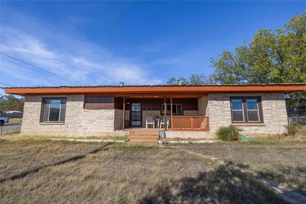front view of a house with yard