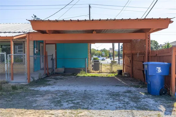 a view of a room with wooden floor and iron fence