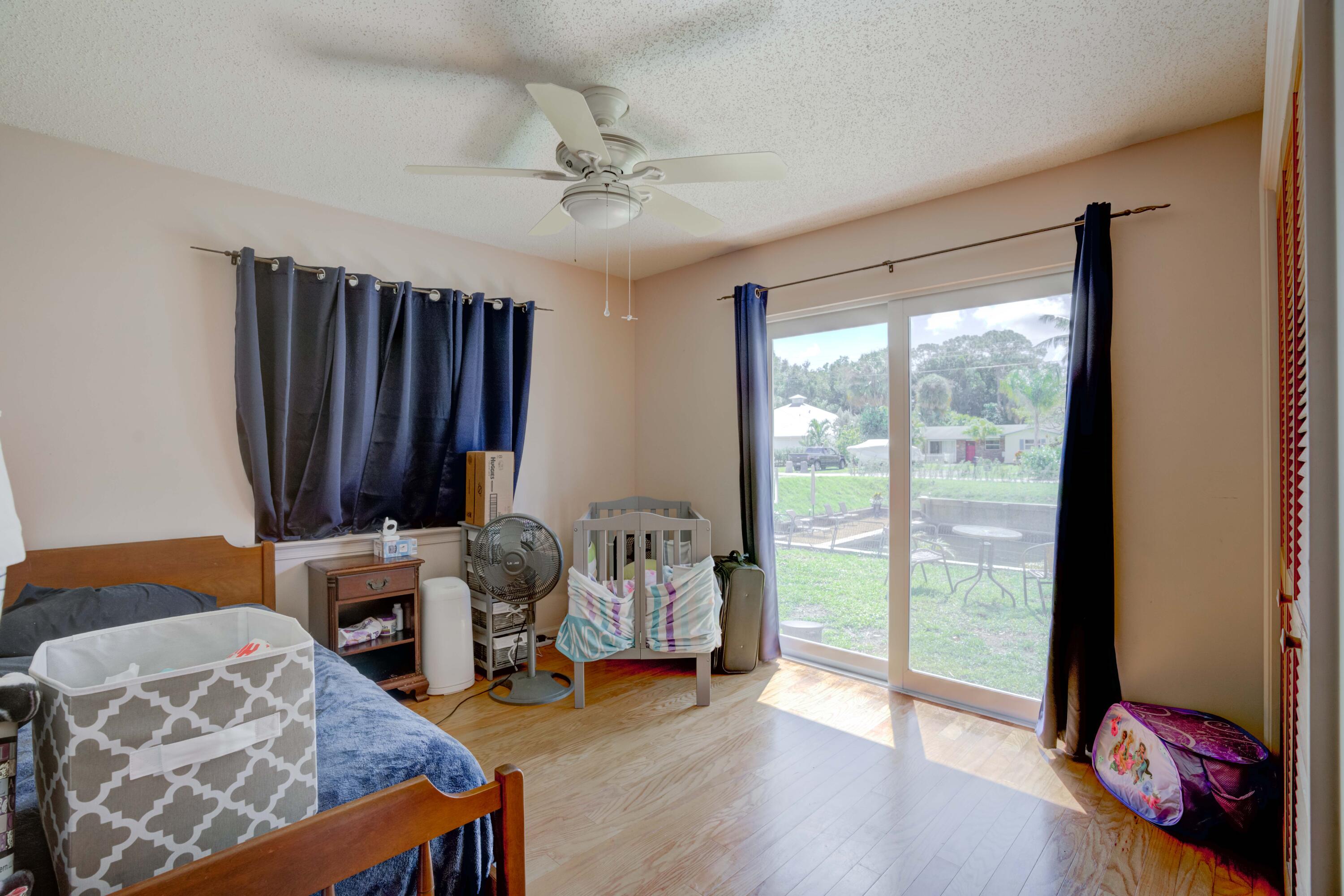 9524 Southeast Cove Point Street Jupiter, FL 33469 - Photo 37 of 58 Guest bedroom