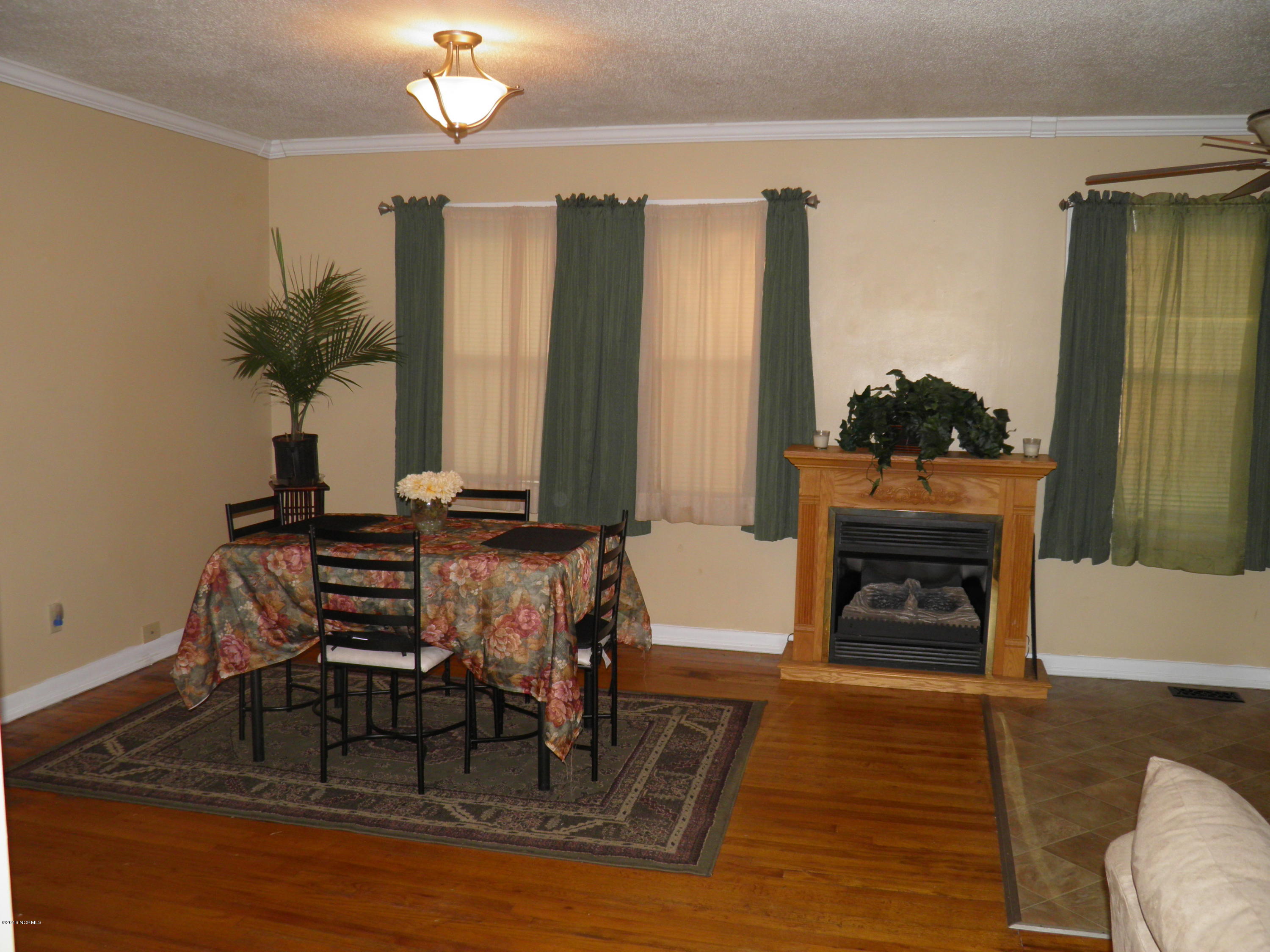 218 Belltown Road Havelock, NC 28532 - Photo 13 of 29 Cozy dining w/fireplace