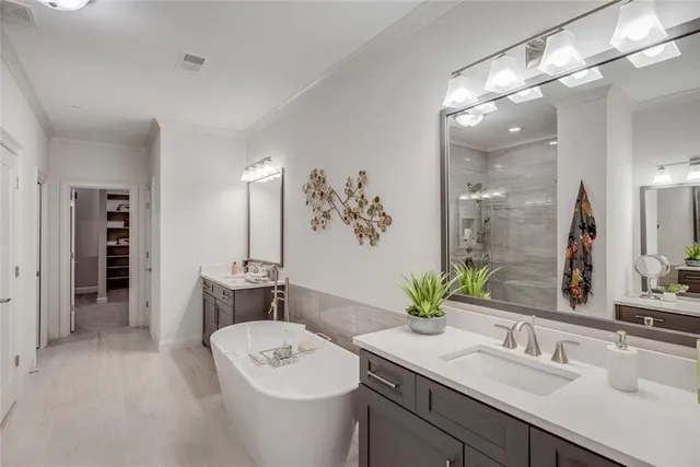 a bathroom with a bathtub and a sink