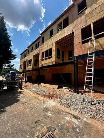 a view of a room with wooden floor and windows