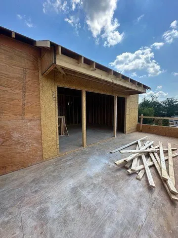 a view of a lake with a house in the background