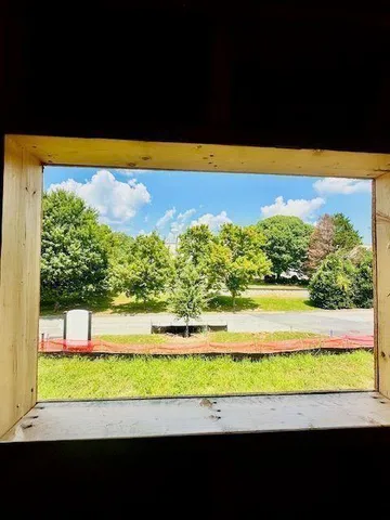 a front view of a building with a swimming pool